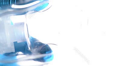 The surgeon is putting a breathing mask on the patient's face. After anesthesia, the