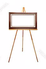 Empty picture frame on wooden easel