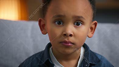 Portrait cute African American child boy looking at camera ethnic boy son baby toddler kid look at home gaze pretty