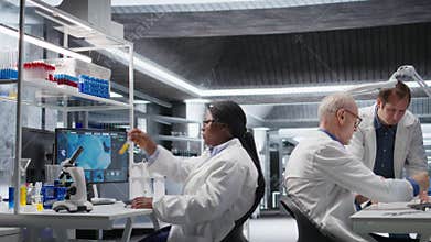 Black female chemistry expert opening laboratory software on pc