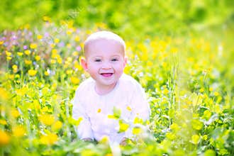 Cute baby n a blooming garden