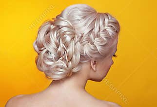 Beauty wedding hairstyle. Bride. Blond girl with curly hair styling