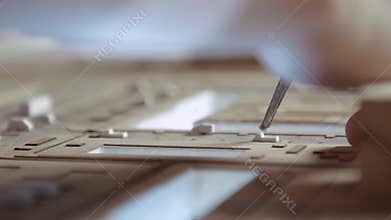 Hands of Professional Man Constructing Architecture Model of Urban City Building