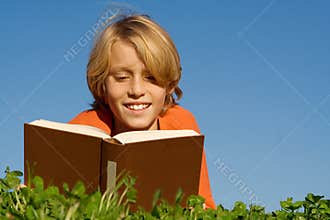 Child reading book or bible
