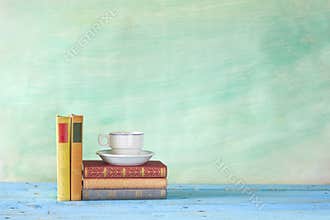 Books with coffee cup,