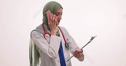 Doctor in hijab explains test results to patient over call