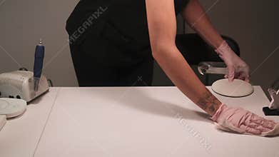 Beauty salon disinfection work surface female hand