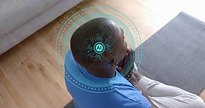 Sitting man in blue-tee pants bowing head hands clasped on dark-gray mat home, with AR-HUD above