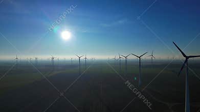 German Wind turbines Farm in field make clean energy. Unique aerial view drone
