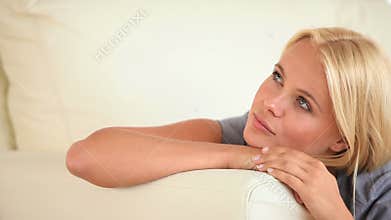 Relaxing woman lying on a sofa