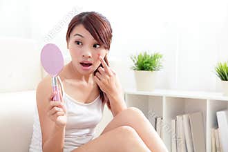 Unhappy Woman finding acne