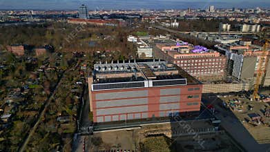 Data center roof with cooling units and solar panels. Amazing aerial view drone