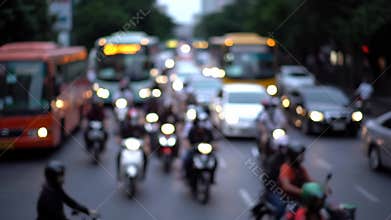 Blurred Motion of City Traffic with Motorcycles and Buses at Dusk