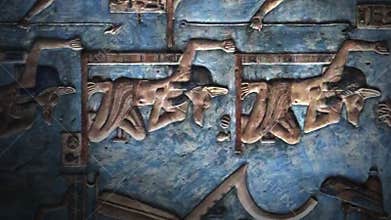 Hieroglyphic carvings and paintings on wall