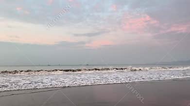 Enjoying the rhythm of the waves crashing.