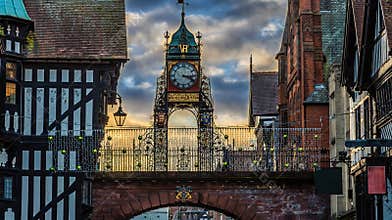 A view from Eastgate Street looking up at the top of the Eastgate in the old walls in the city of Chester