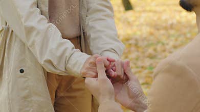 Surprised emotional happy Arabian woman glad marriage propose with Hispanic man in autumn park couple engagement