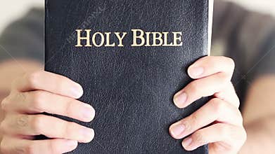 Young Man Proudly Showing Off His Bible