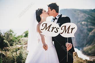 Bride and groom with Mr and Mrs signs