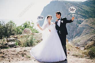 Bride and groom with Mr and Mrs signs