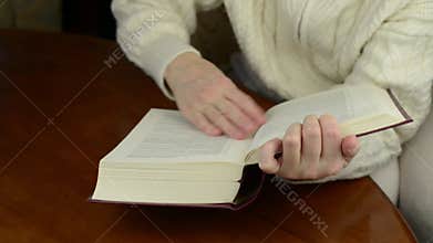 Flipping and turning book pages capturing the crisp sound of paper-thin sheets