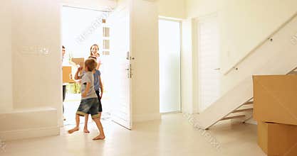 Happy family moving into their new home