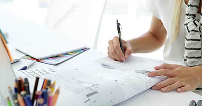 Cute creative designer working on her computer