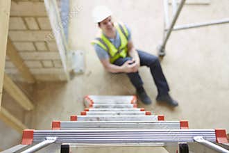 Construction Worker Falling Off Ladder And Injuring Leg
