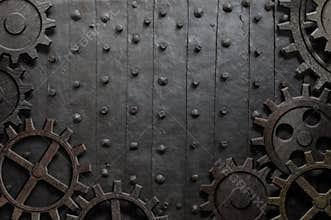 Old metal background with rusty gears and cogs