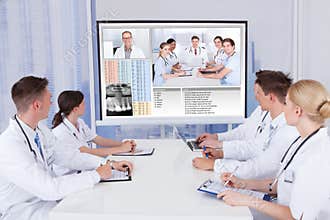 Doctors having video conference meeting in hospital