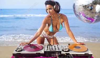 Beautiful woman dj at beach