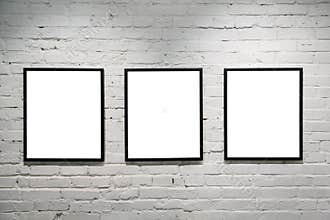 Black frames on white brick wall 3