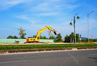 Excavator on road construction. Screeding ground for installing borders, curbs concrete blocks at road.