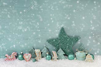 Wooden christmas background mint green with snow.