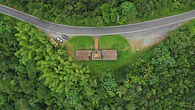Top-down view revealing the geometric layout of Santa Ana Stone Tower, amid dense tropical forest