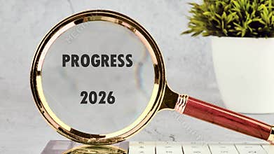 A magnifying glass focuses on 'PROGRESS 2026,' emphasizing strategy and success