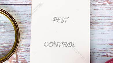 PEST CONTROL message appears on a white piece of notebook paper. Pest control service protective concept