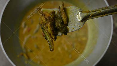 Small Snakehead or Channa orientalis fish curry.