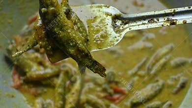 Small Snakehead or Channa orientalis fish curry.