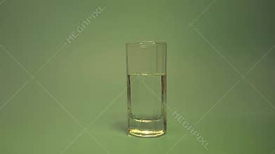 A glass of clear alcohol with a multicolored club light.