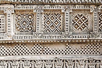 Intricate Stone Carvings With Geometric Motifs and Ornate Borders on Ancient Wall Frieze - Rani Ki Vav, Patan, Gujarat
