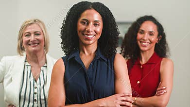 Confident Diverse Businesswomen Team Smiling at the Camera in a Professional Office Setting