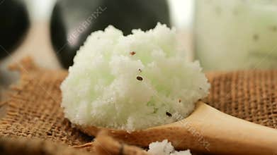 Refreshing aloe vera scrub on a wooden spoon
