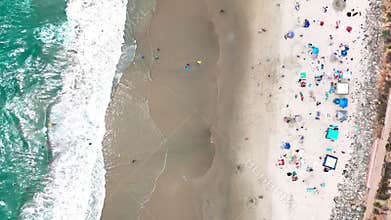Aerial nature top down ocean waves on the beach southern Del Mar San Diego California CA