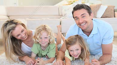 Happy family lying on the front