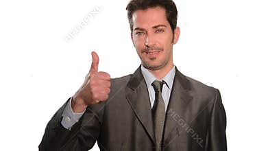 Handsome businessman gesturing thumbs up