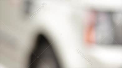 Woman hand presses on the remote control car alarm