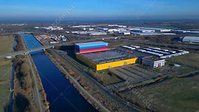 Drugstore Logistics Center building alongside canal. Perfect aerial view drone