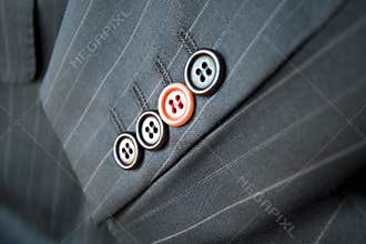 Business difference / Red suit button standing out