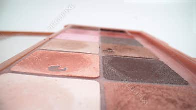 Close up of makeup palette with colorful shades